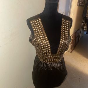 Woman’s v neck dress shirt with gold like beads